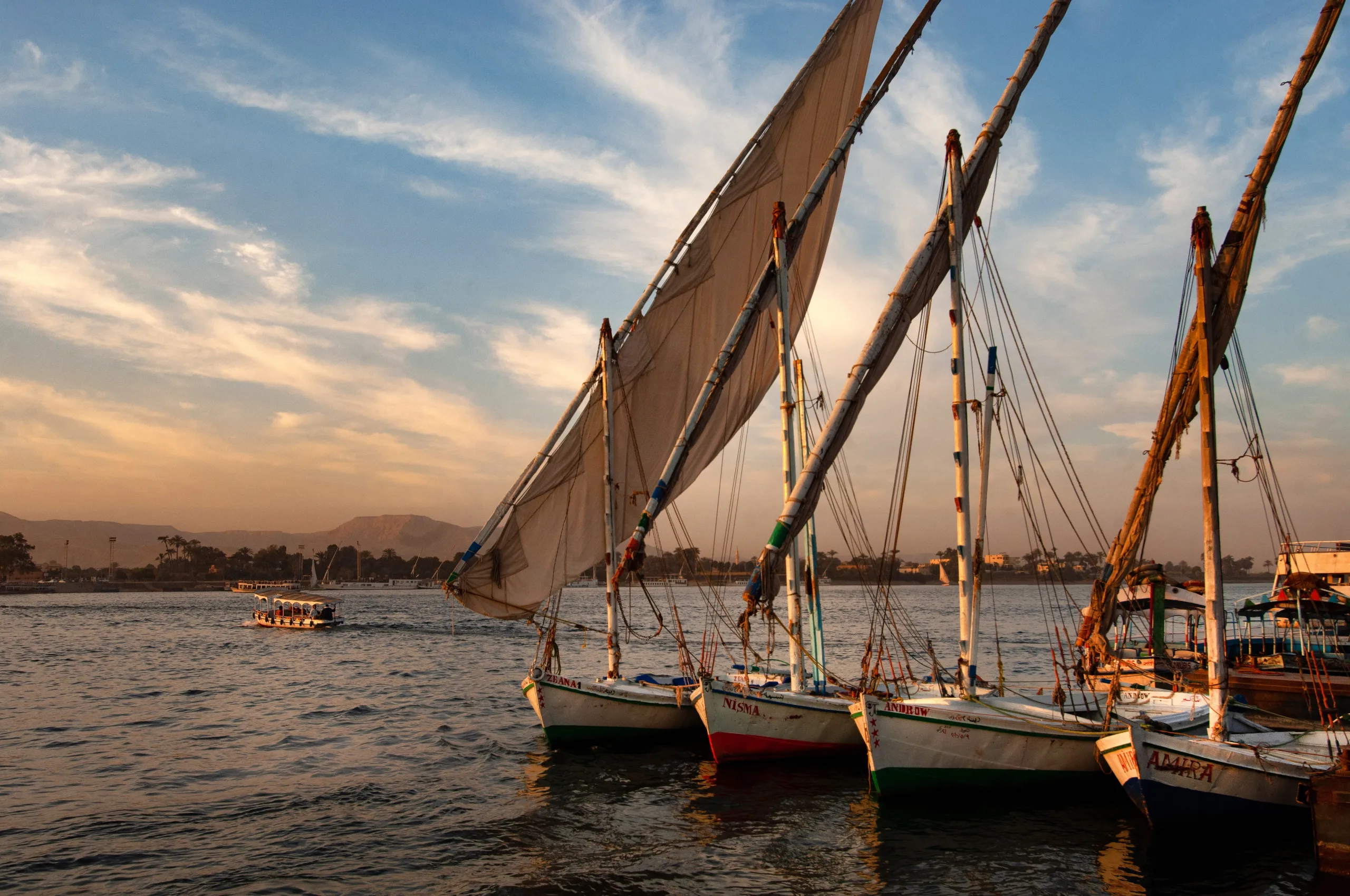 shot numerous boats berthed by pier straight line sunset