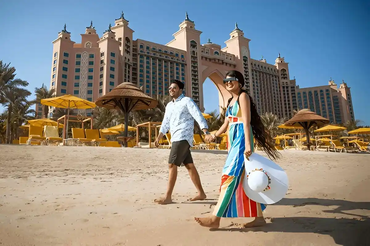 Luxury car with a chauffeur driving through iconic Dubai landmarks during a personalized city tour